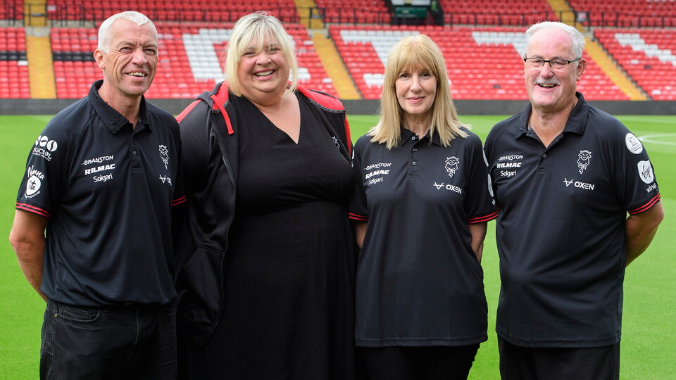 A photo of Lincoln City's Supporters Liaison Officers