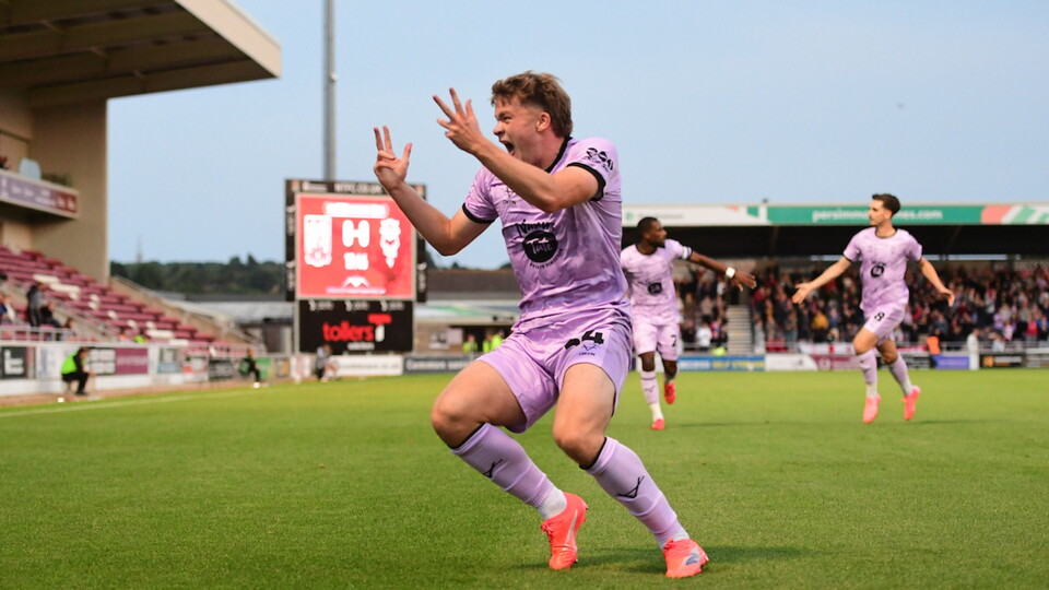 Freddie Draper of Lincoln City, right, celebrates scoring the opening goal with team-mate Rob Street during the EFL Sky Bet League One match between Northampton Town and Lincoln City at Sixfields Stadium, Northampton.