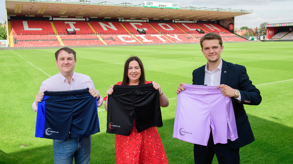 Lincoln City commercial partnership - Bobby Copping, head of commercial of Lincoln City, right, with the club’s new shorts sponsor, IFI Group Ltd, at LNER Stadium, Lincoln.