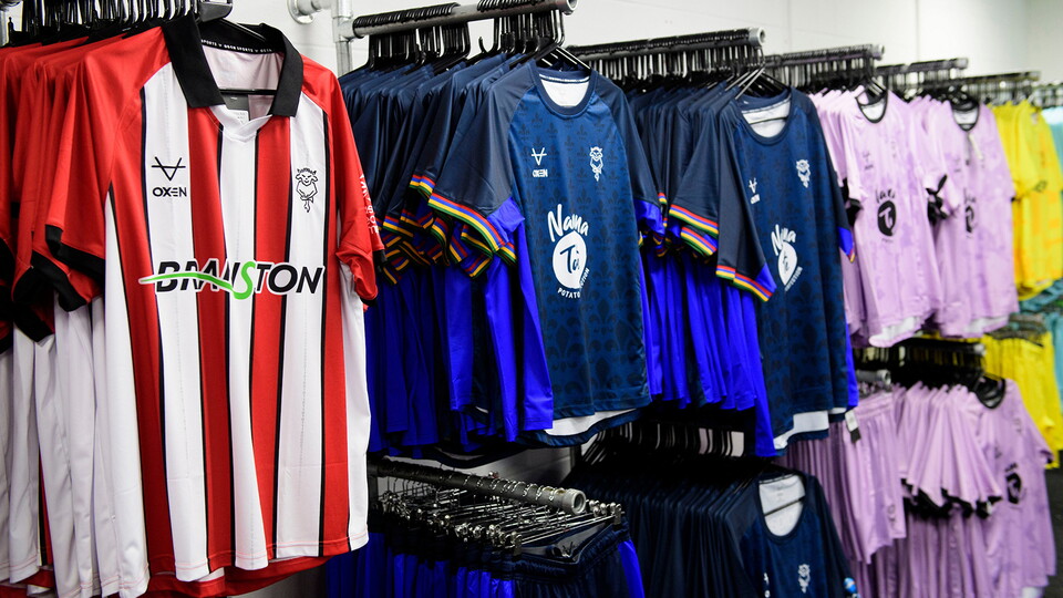 Shirts hung up in the Lincoln City club store