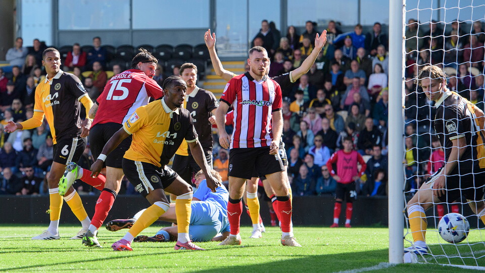 Sonny Bradley heads in a goal for Lincoln City at Burton Albion
