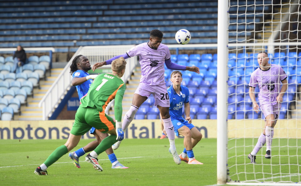 Justin Obikwu heads home from close range to put Lincoln City 3-0 ahead