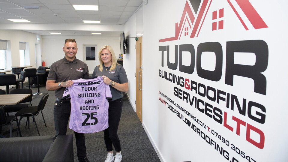 Lincoln City commercial partnership | Bobby Copping, head of commercial of Lincoln City with Tudor Building and Roofing Services, the new sponsors of the players lounge at Lincoln City’s LNER Stadium