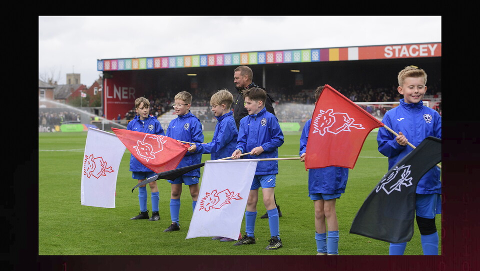 A matchday experience image from the Imps vs Exeter