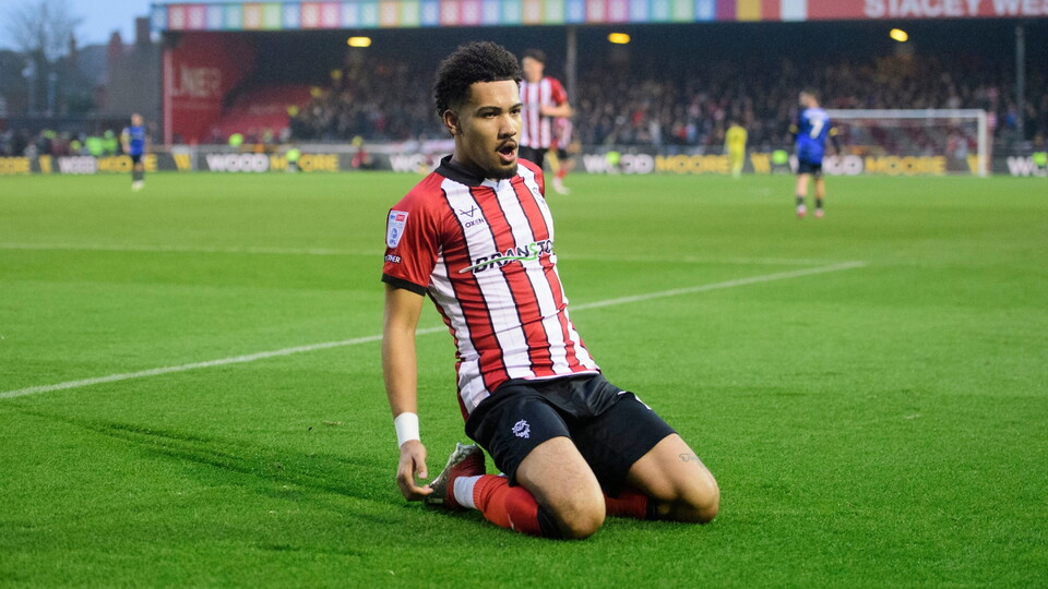 Frankie Okoronkwo of Lincoln City celebrates scoring the opening goal during the EFL Sky Bet League One match between Lincoln City and Doncaster Rovers at LNER Stadium, Lincoln.