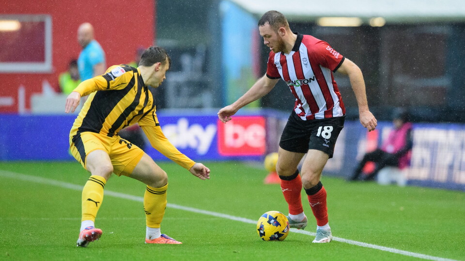 Ben House of Lincoln City vies for possession during the EFL Sky Bet League One match between Lincoln City and Port Vale at LNER Stadium, Lincoln.