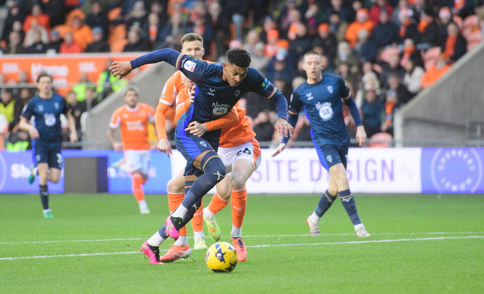 Reeco Hackett of Lincoln City vies for possession with Zac Ashworth of Blackpool during the EFL Sky Bet League One match between Blackpool and Lincoln City at Bloomfield Road, Blackpool.