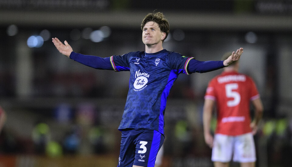 Adam Reach holds his arms out in celebration after scoring a goal