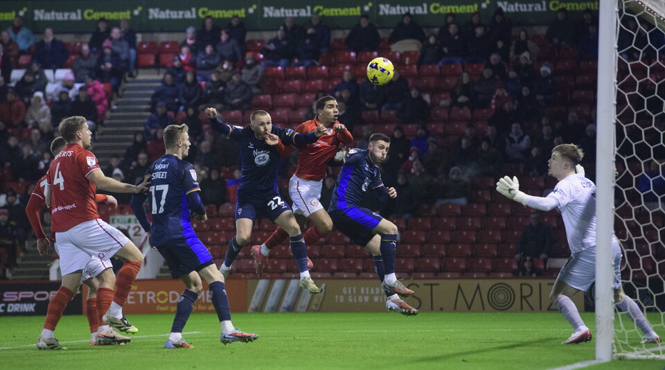 Tom Hamer heads the ball towards goal to put Lincoln City 1-0 ahead at Barnsley.