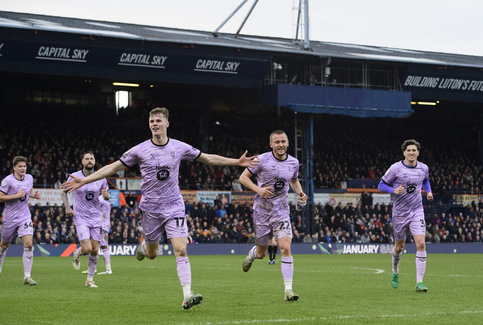 Rob Street holds his arms aloft in celebration