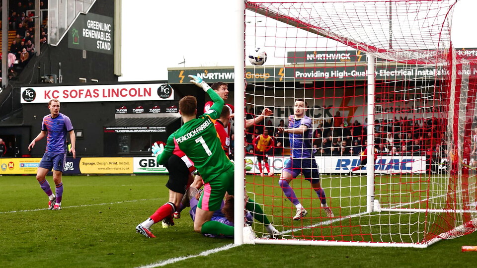 Conor McGrandles heads the ball to score