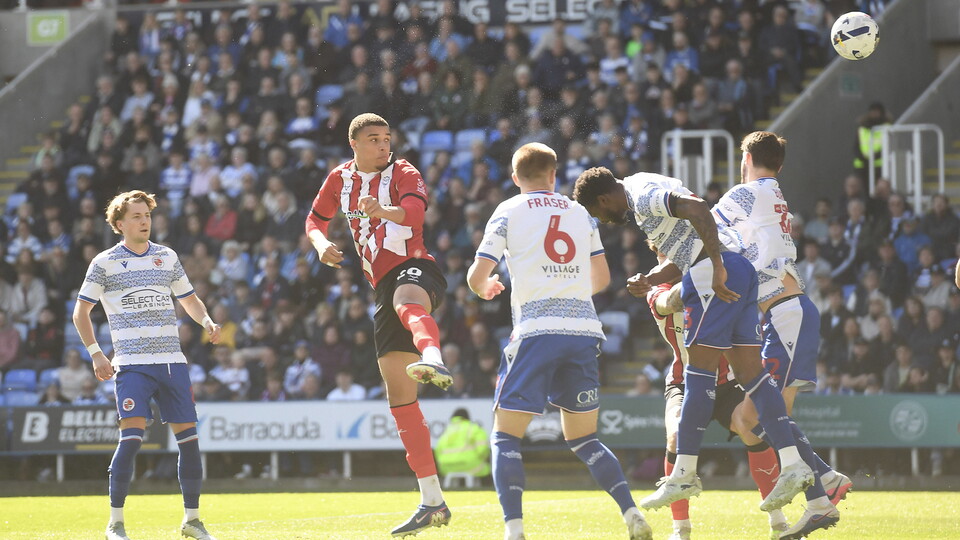 Ryan Oné heads Lincoln City into the lead at Reading