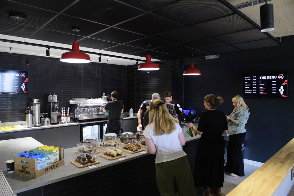 A general shot of people being served at a counter