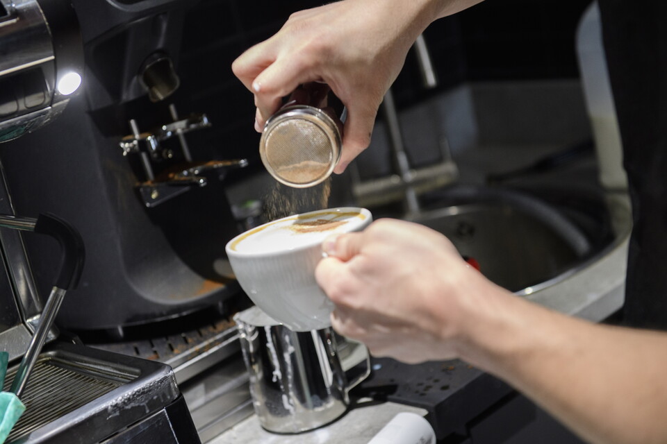 A man makes a coffee
