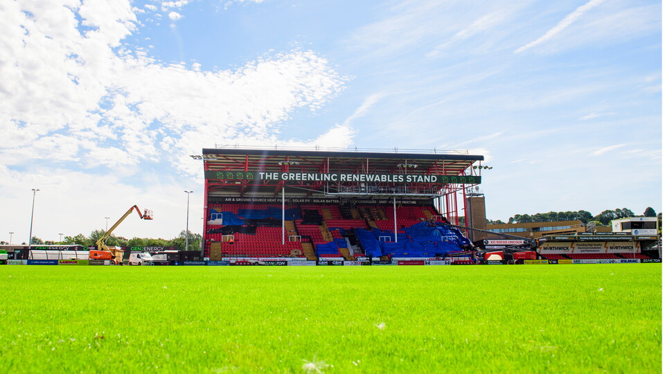 A view of work going on in the Greenlinc Renewables Stand, including brand new red seats throughout.