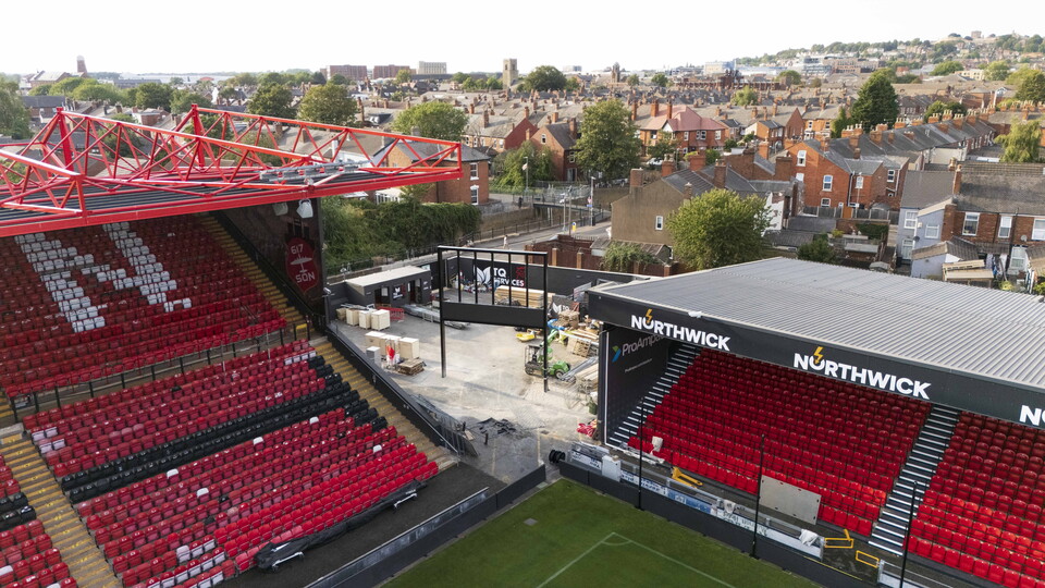 A metal frame positioned between two football stands