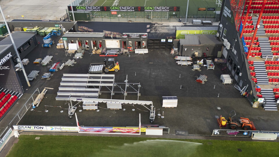 An overhead view of a football stand being built