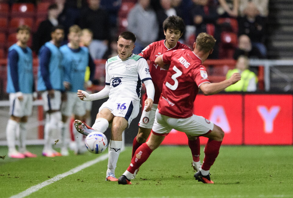 Dom Jefferies kicks the ball forward