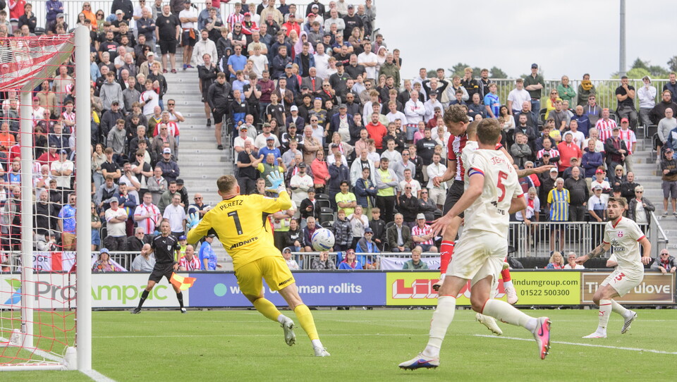 Mikkel Ladefoged heads home the equalising goal.