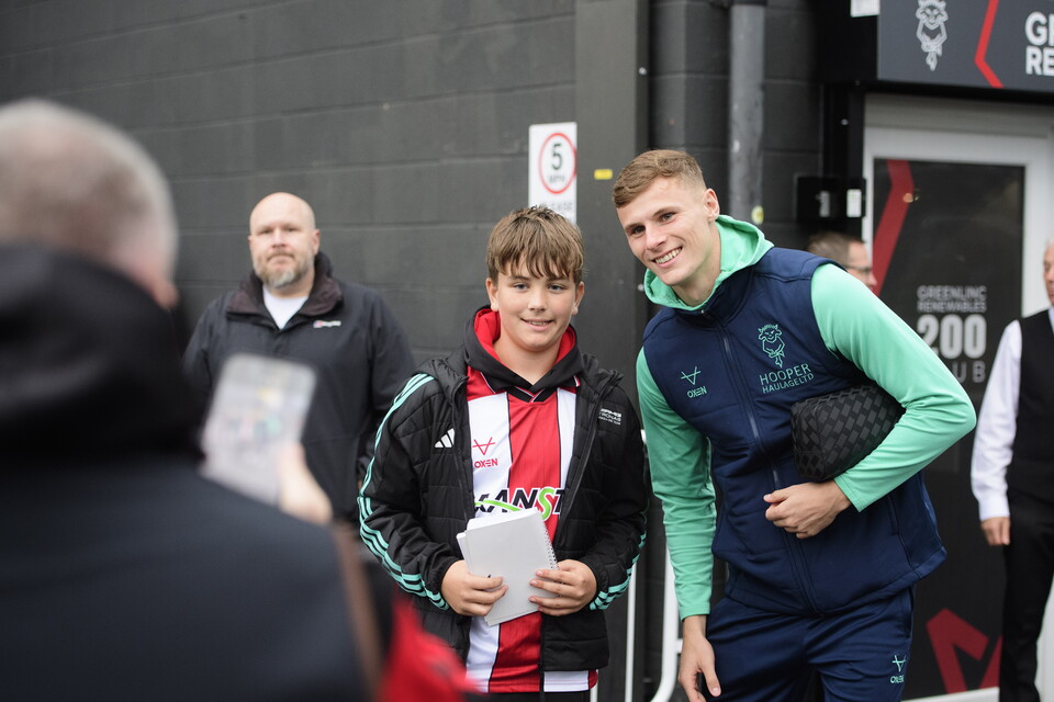 Rob Street poses with a young fan