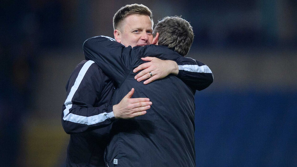 Tom Shaw and Michael Skubala pictured hugging after a game.