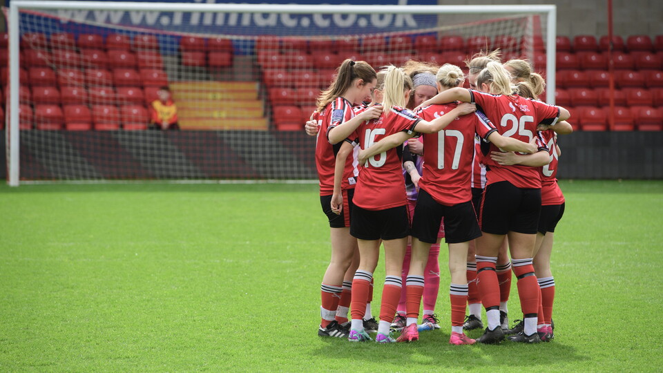 City Women in a huddle.
