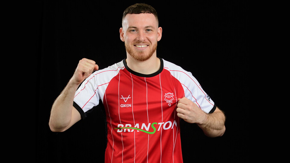 Ben House models City's new home shirt