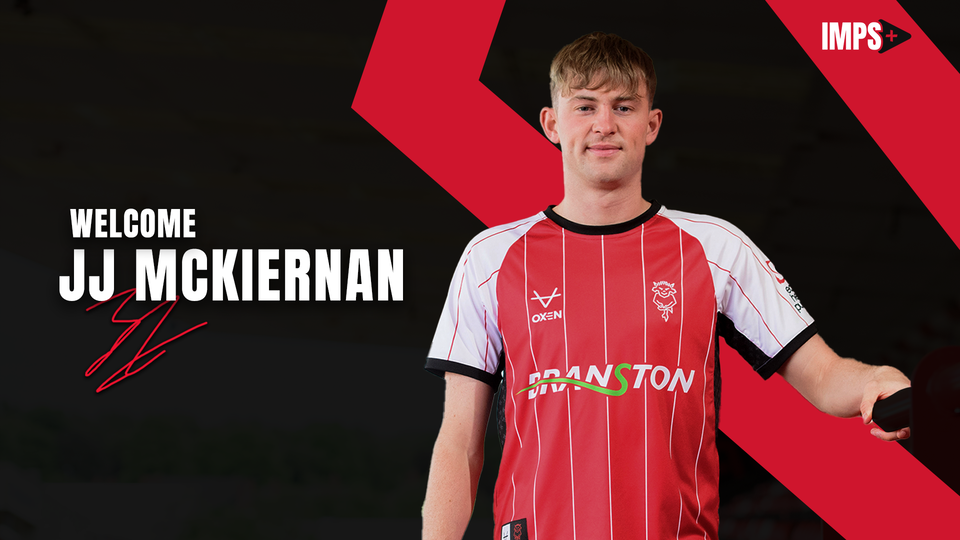 JJ McKiernan poses in a red Lincoln City home shirt. Text overlaid reads: "Welcome JJ McKiernan"