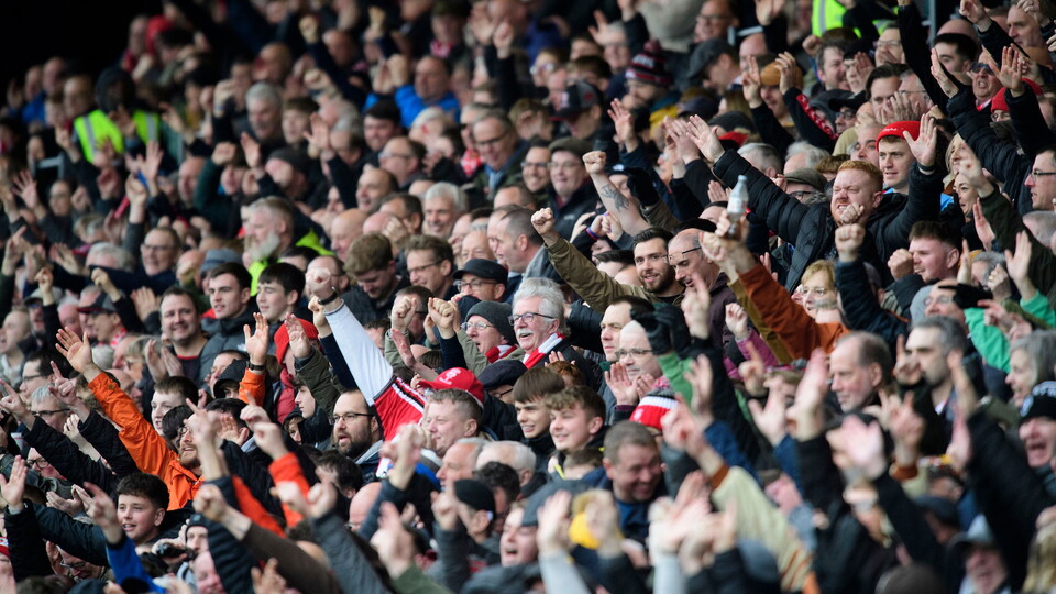 City supporters celebrate.