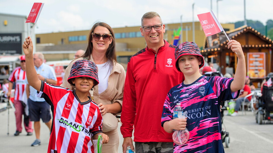 City supporters pose for a photo.