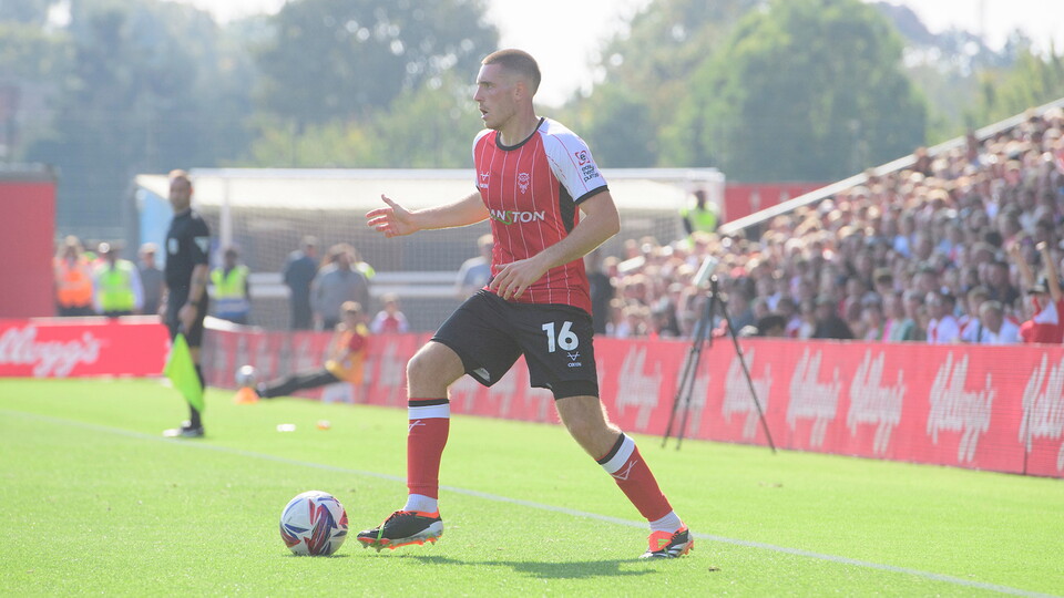 Dom Jefferies on the ball for Lincoln City against Wigan Athletic