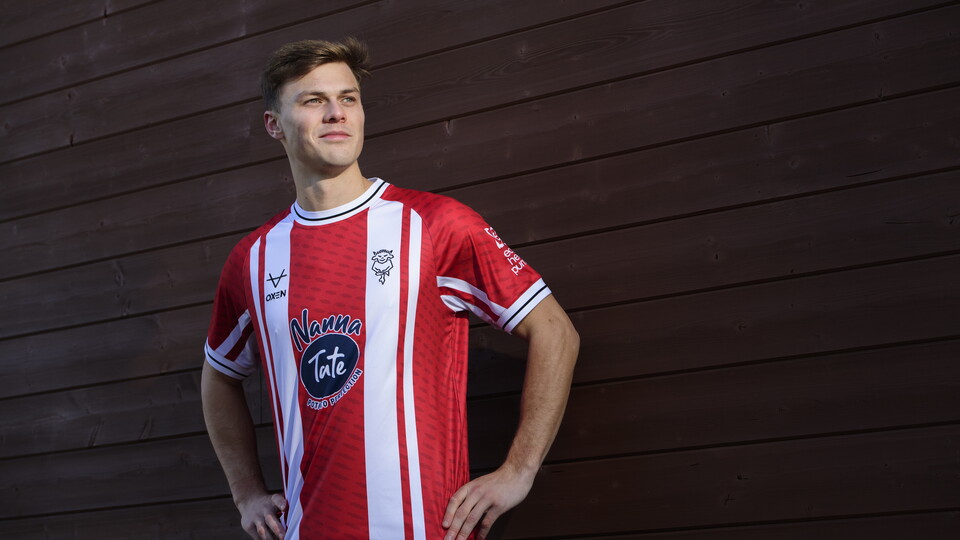 Erik Ring wears the special edition Lincoln City shirt.