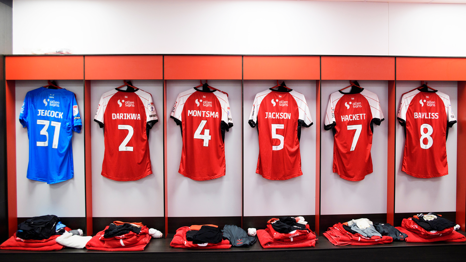 football shirts hung up