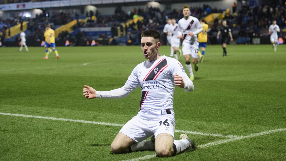 Lincoln City's Dom Jefferies celebrates his goal against Mansfield Town