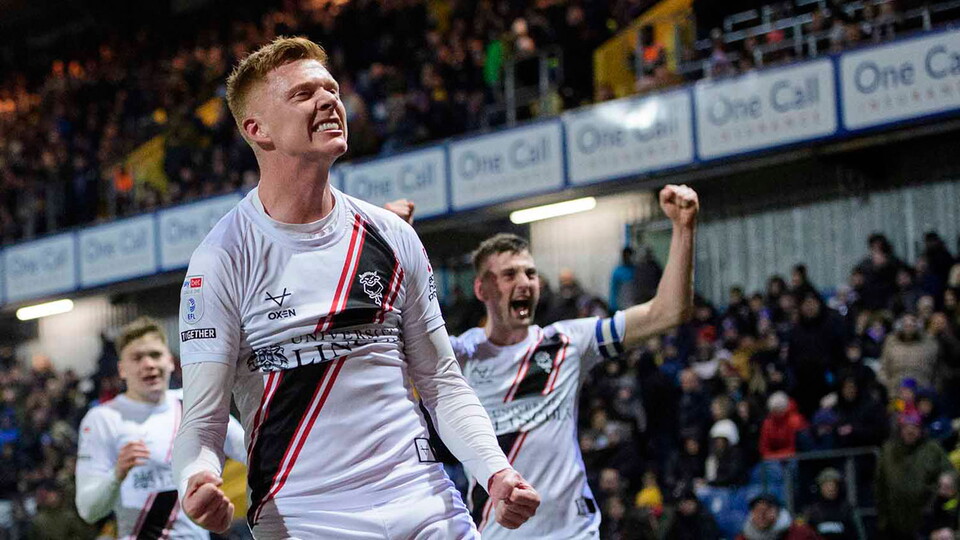 Sam Clucas celebrates scoring for City at Mansfield Town
