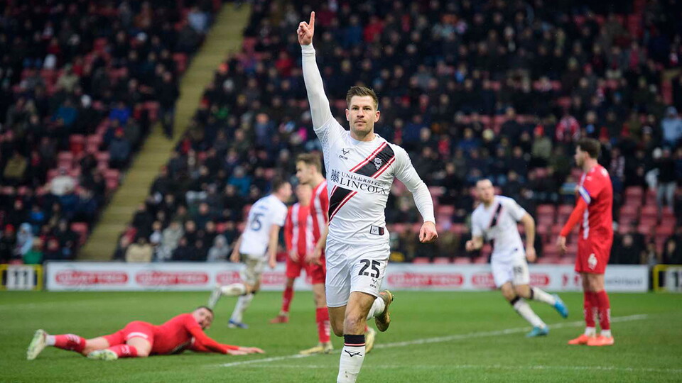 James Collins celebrates his goal for City at Leyton Orient