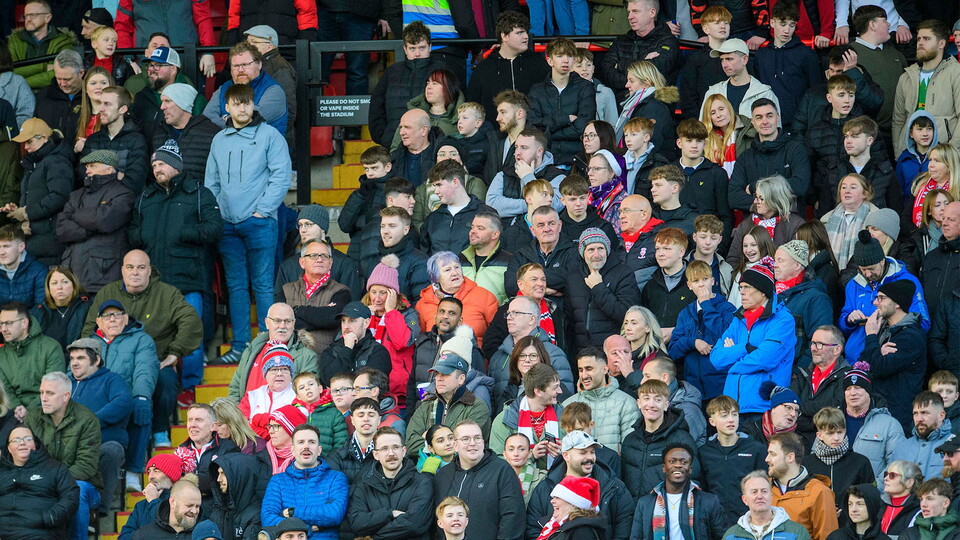 Fans in the Greenlinc Renewables Stand of the LNER Stadium