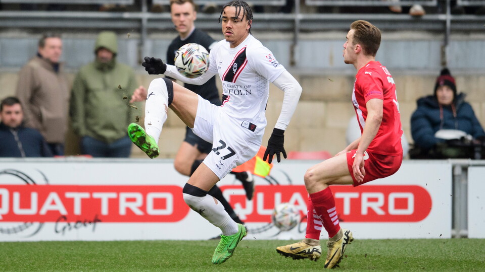 Jovon Makama controls a football and gets away from a Leyton Orient defender.