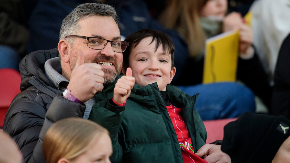 Fans at the LNER Stadium giving the thumbs up
