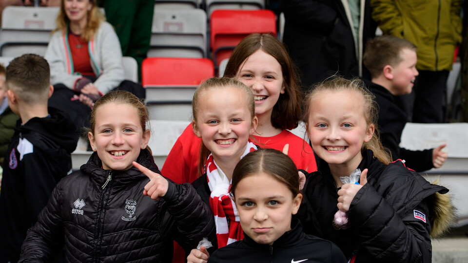 A group of fans enjoying the pre-match atmosphere at the LNER Stadium