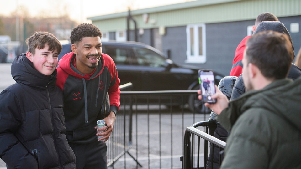 Reeco Hackett having his photo taken with a fan outside the LNER Stadium
