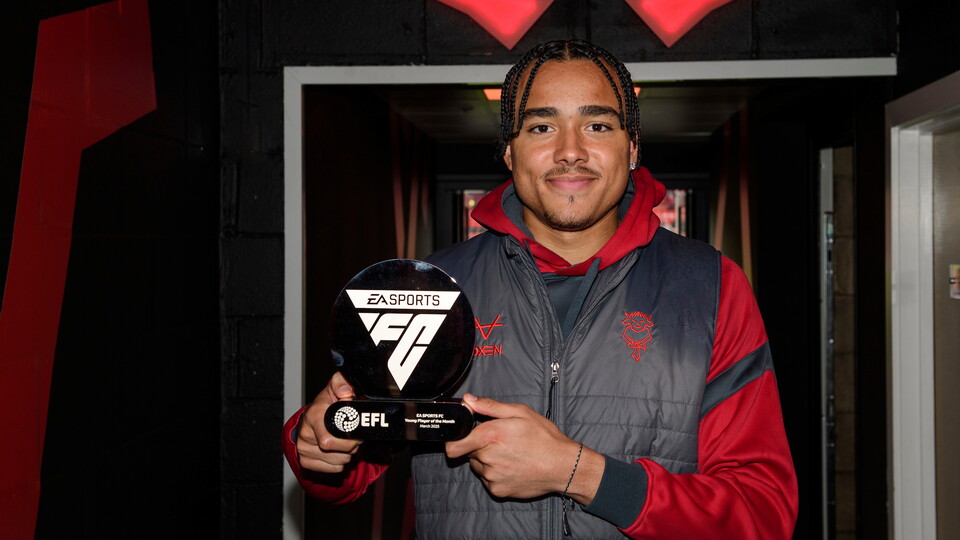 Jovon Makama of Lincoln City with the EA Sports FC Young Player of the Month trophy for March 2025 in the tunnel prior to the EFL Sky Bet League One match between Lincoln City and Bolton Wanderers at LNER Stadium, Lincoln.