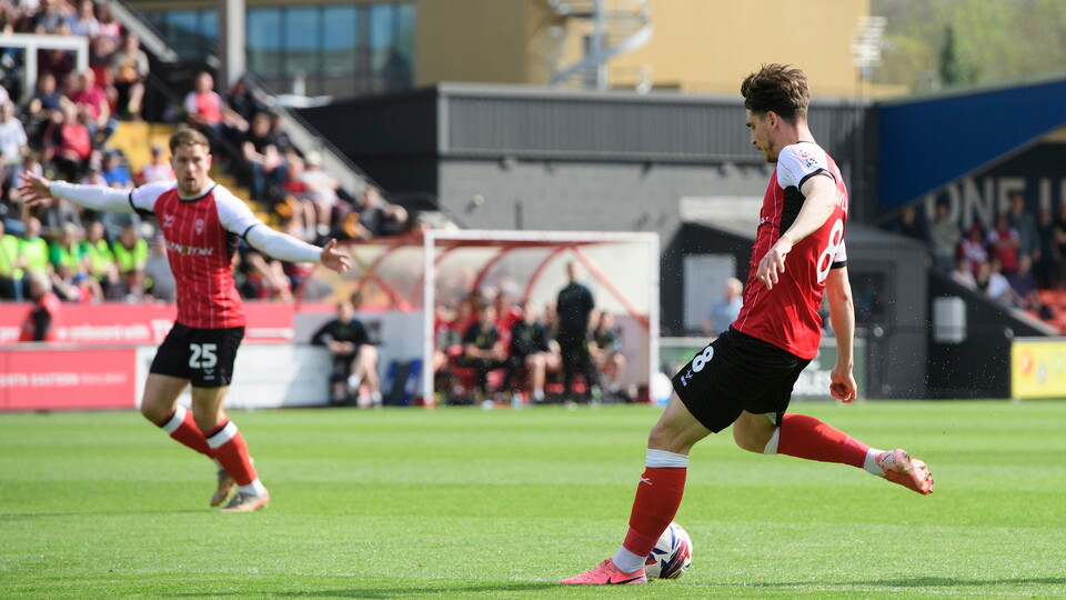 Tom Bayliss of Lincoln City scores the opening goal during the EFL Sky Bet League One match between Lincoln City and Shrewsbury Town at LNER Stadium, Lincoln.