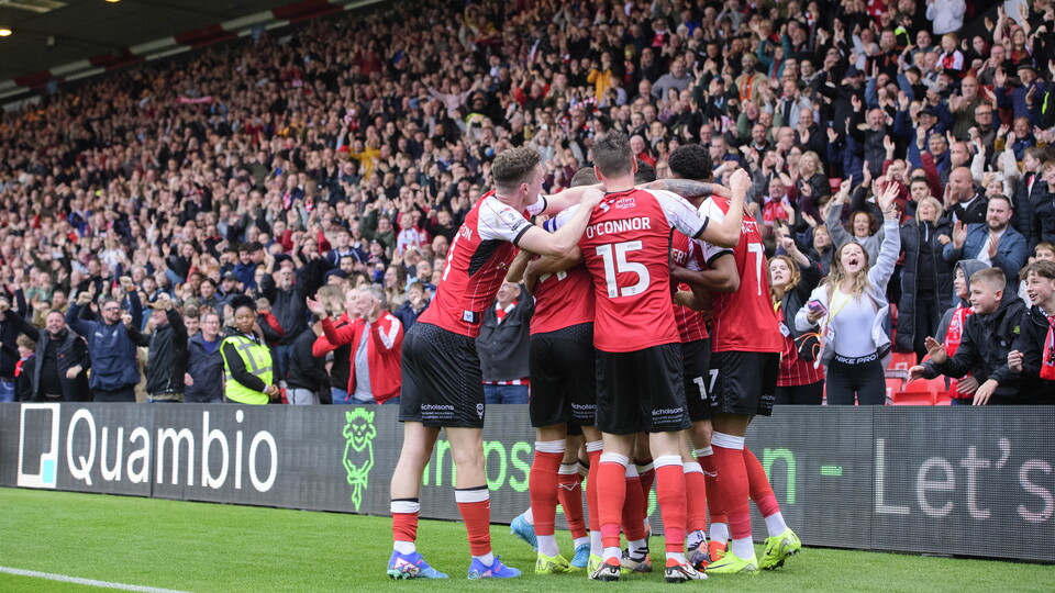Lincoln City players celebrate a goal