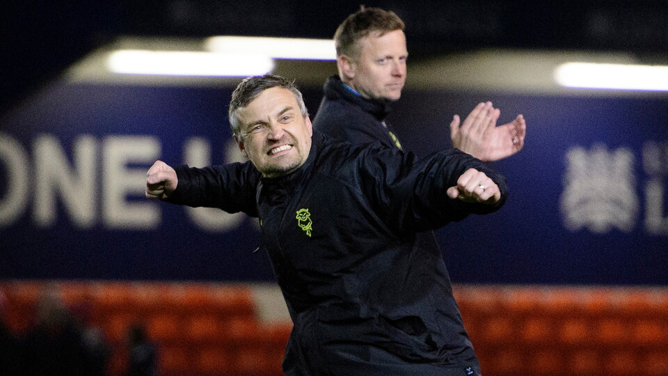 Michael Skubala celebrates at full-time of the win over Huddersfield Town