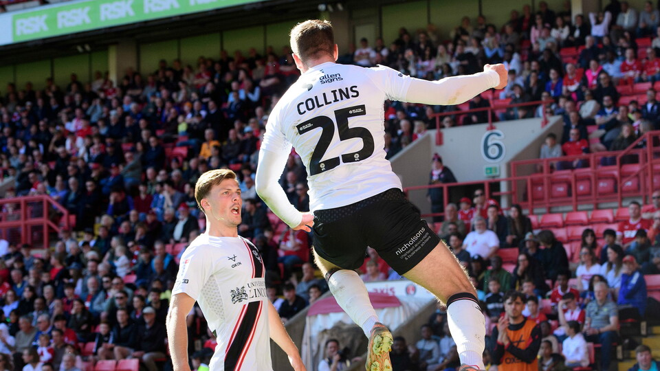 James Collins celebrates with Erik Ring after opening the scoring against Charlton Athletic.
