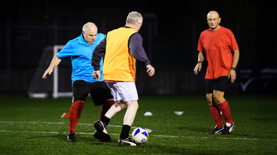 man walking football