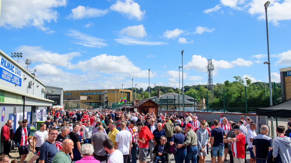 Lincoln City fans enjoy the pre-match atmosphere in the University of Lincoln Fan Village.