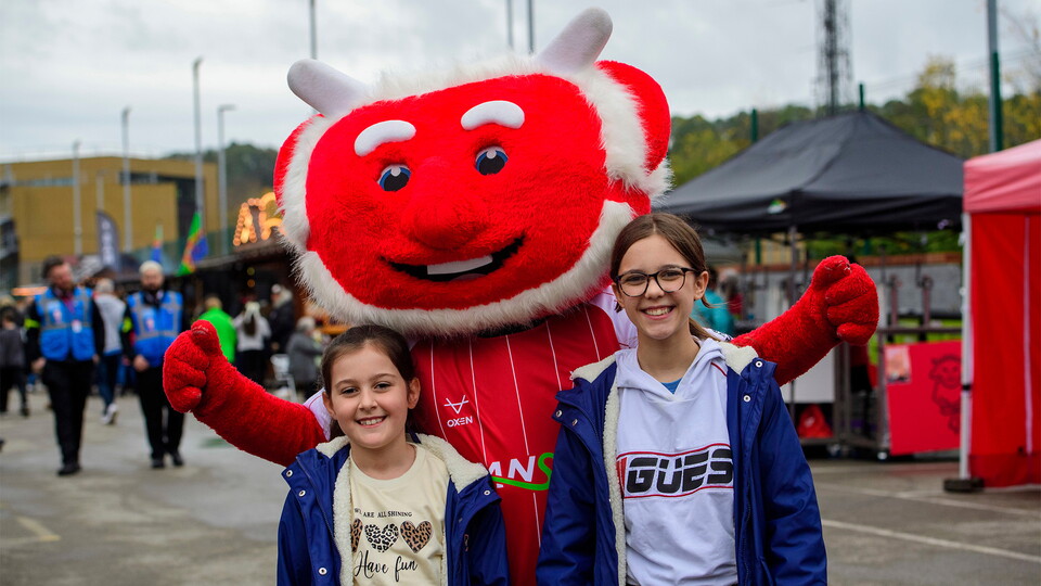 Poacher the Imp, mascot of Lincoln City with fans in the University of Lincoln Fan Village prior to the EFL Sky Bet League One match between Lincoln City and Stockport County at LNER Stadium, Lincoln.