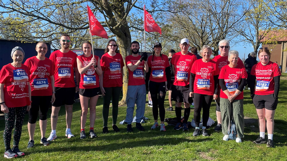 A group of fundraisers pose for a photograph prior to the Lincoln 10k.